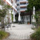 08-durch-den-Rosenbogen-zur-Cafeterrasse Planung Christian Grote Landschaftsarchitekt gründesign